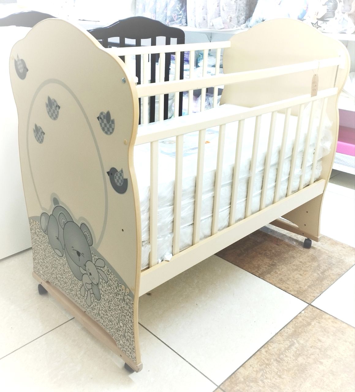 Кровать детская ЛДСП NEW SLEPPY колесо-качалка  (сл.кость) (1200х600)