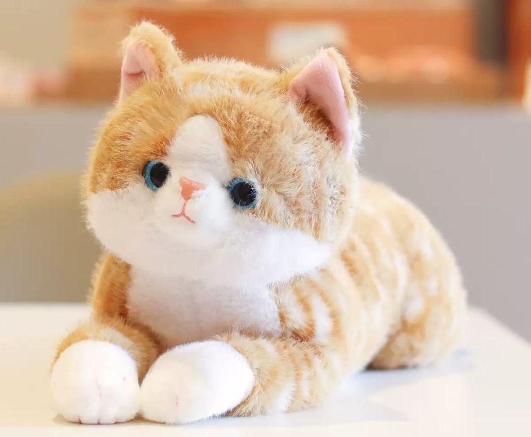 Мягкая игрушка кошечка лежит коричневая 45 см